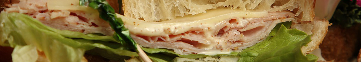 Eating Sandwich at Friar Tuck's Hoagie House restaurant in Fairbanks, AK.